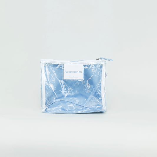 Blue toile-patterned pouch on a light gray background