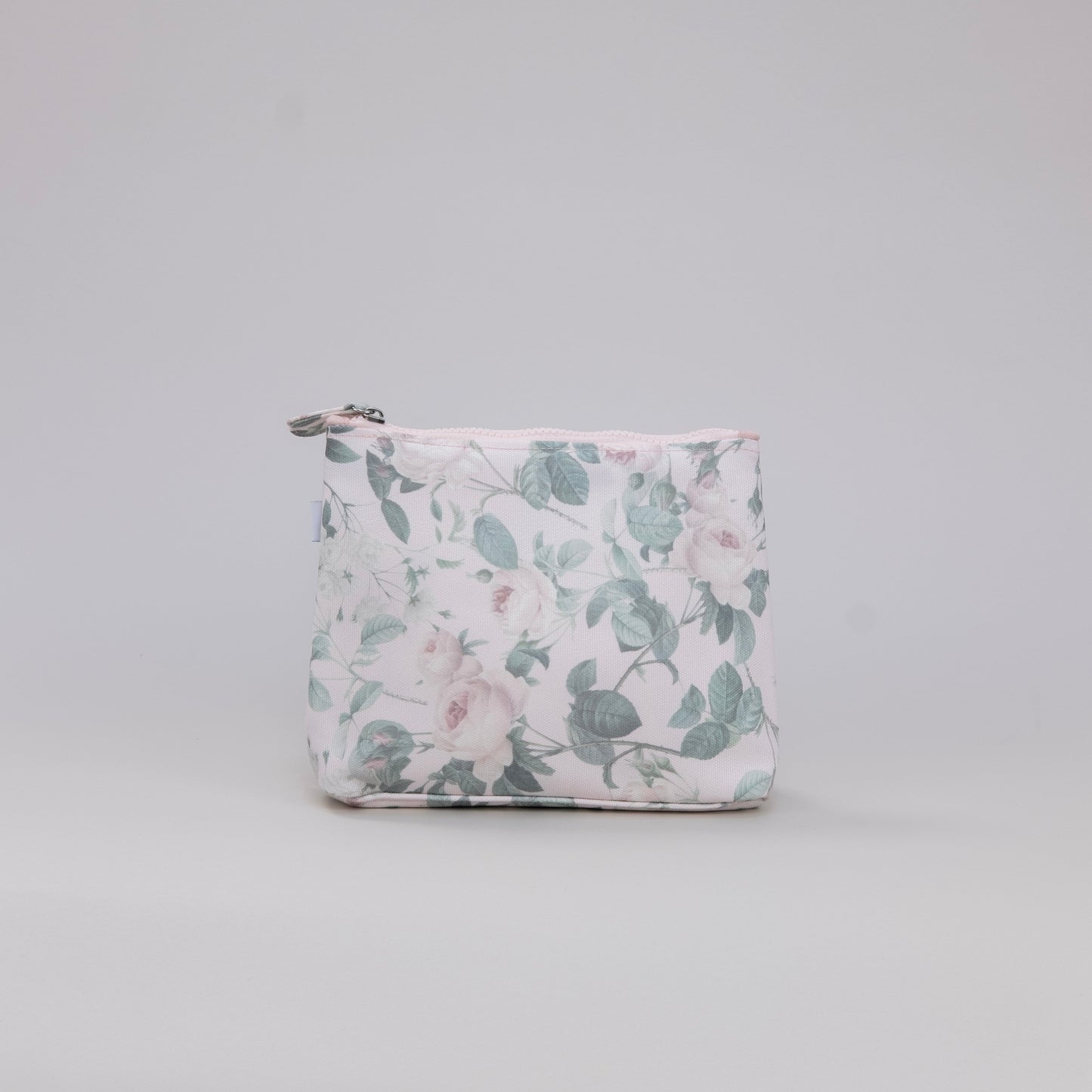 Floral-patterned pouch on a light gray background