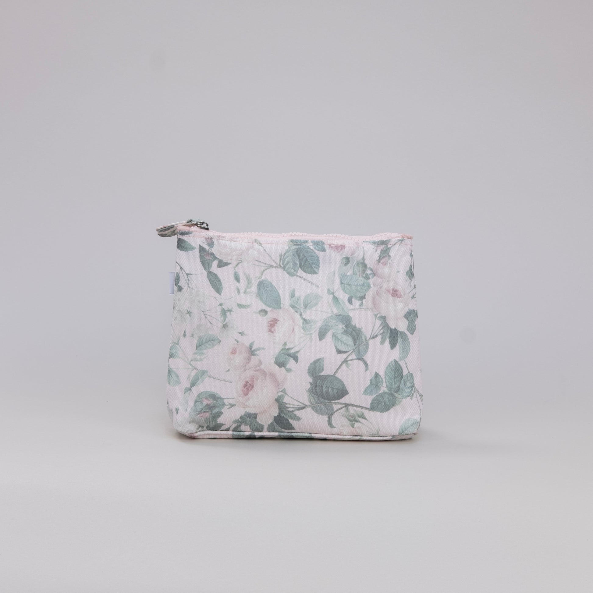 Floral-patterned pouch on a light gray background