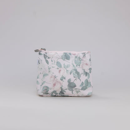 Floral-patterned pouch on a light gray background